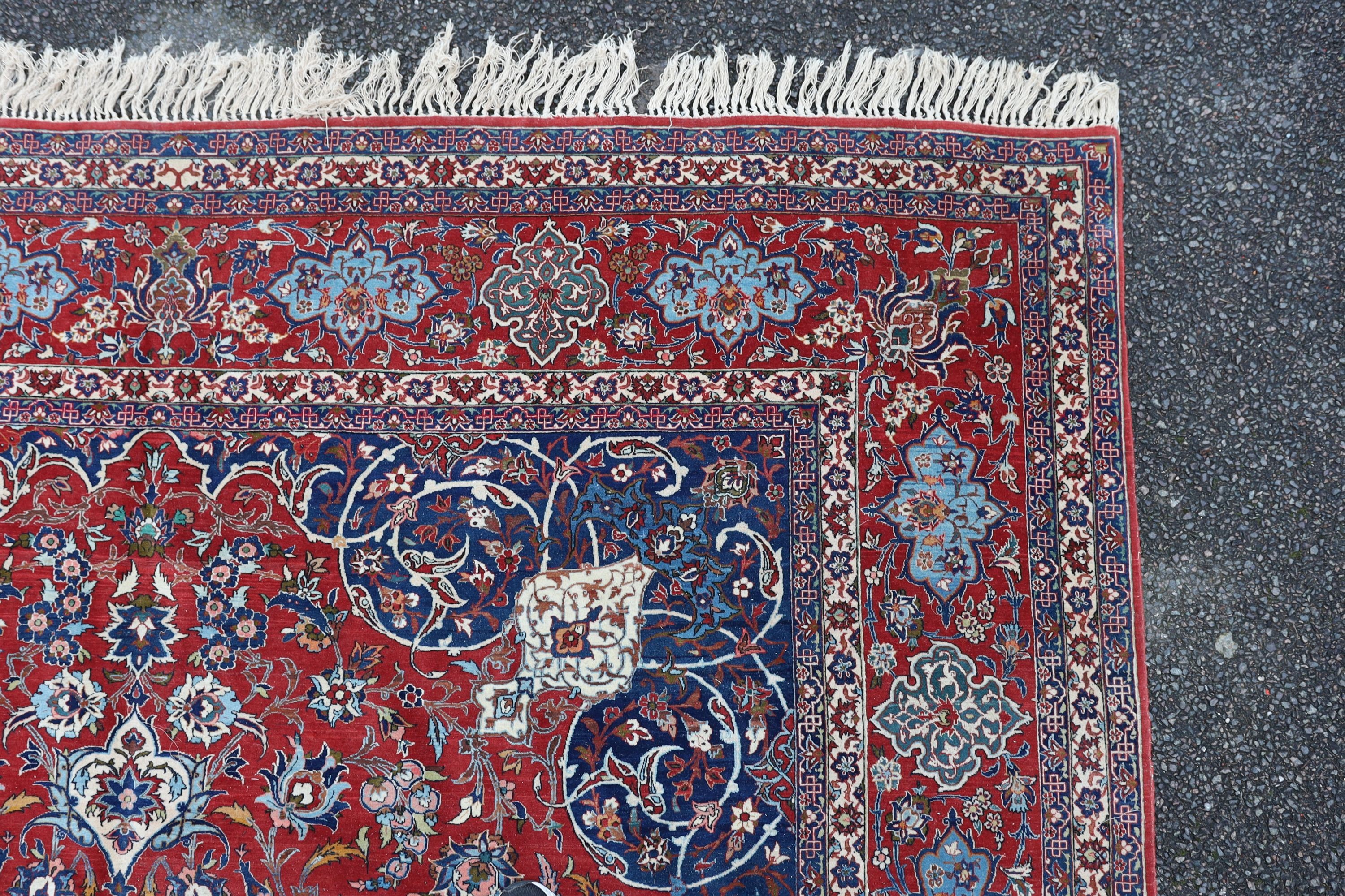 A Isfahan red ground carpet 350 x 260cm.